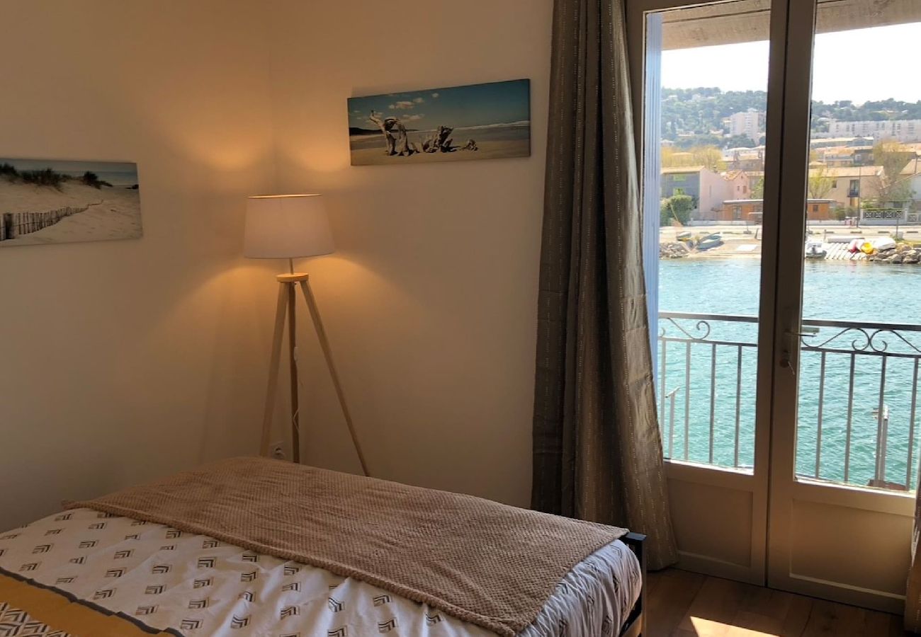 Bedroom on the second floor overlooking the quay and canal.